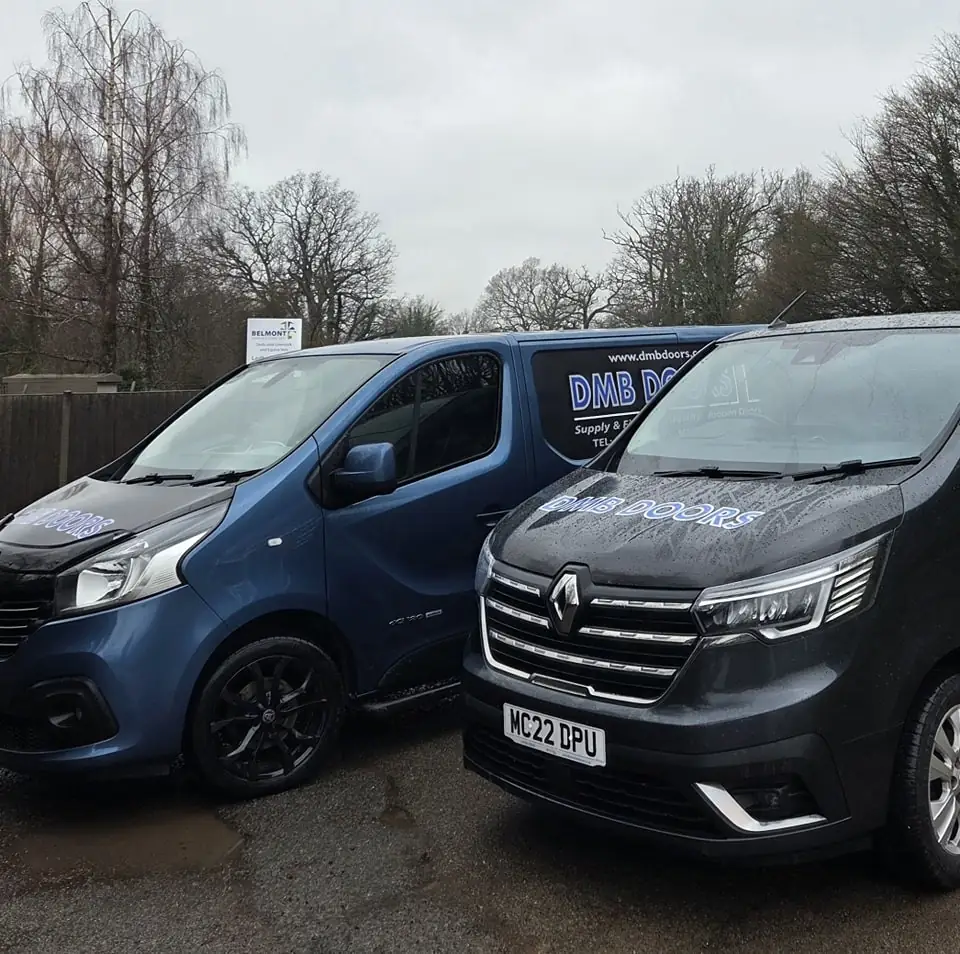 Two DMB Doors vans viewed from the front